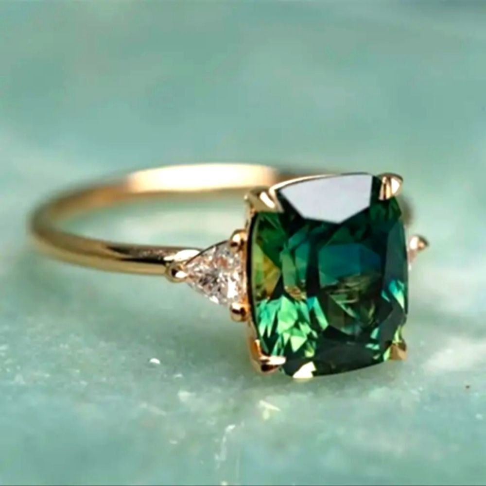 EMERALD cut green stone engagement ring